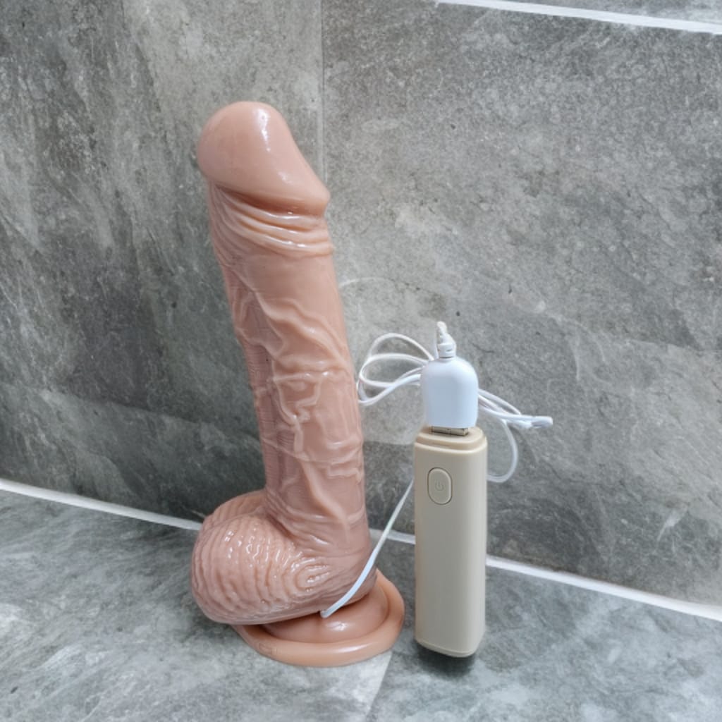 Vibrador de 20 cm con patrones de vibración variados, diseño ergonómico y material seguro para la piel.