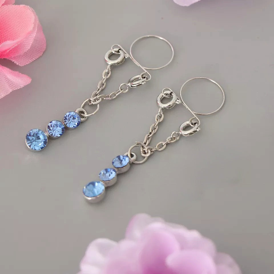 Descubre el poder de la elegancia con estos colgantes de pezón con gotas de rubí. Sensuales, sin dolor y perfectos para noches especiales. Disponible en Guatemala.