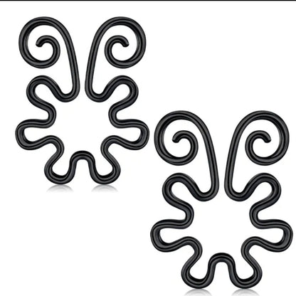 Estas pezoneras con alas decorativas simulan piercings de forma segura y sensual. Diseño sin perforación que estimula y adorna. Ideal para lencería sexy.